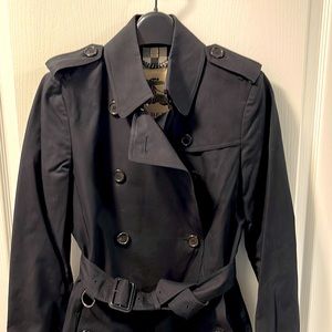 Burberry black trench coat. In excellent pre-loved condition. Size 4.